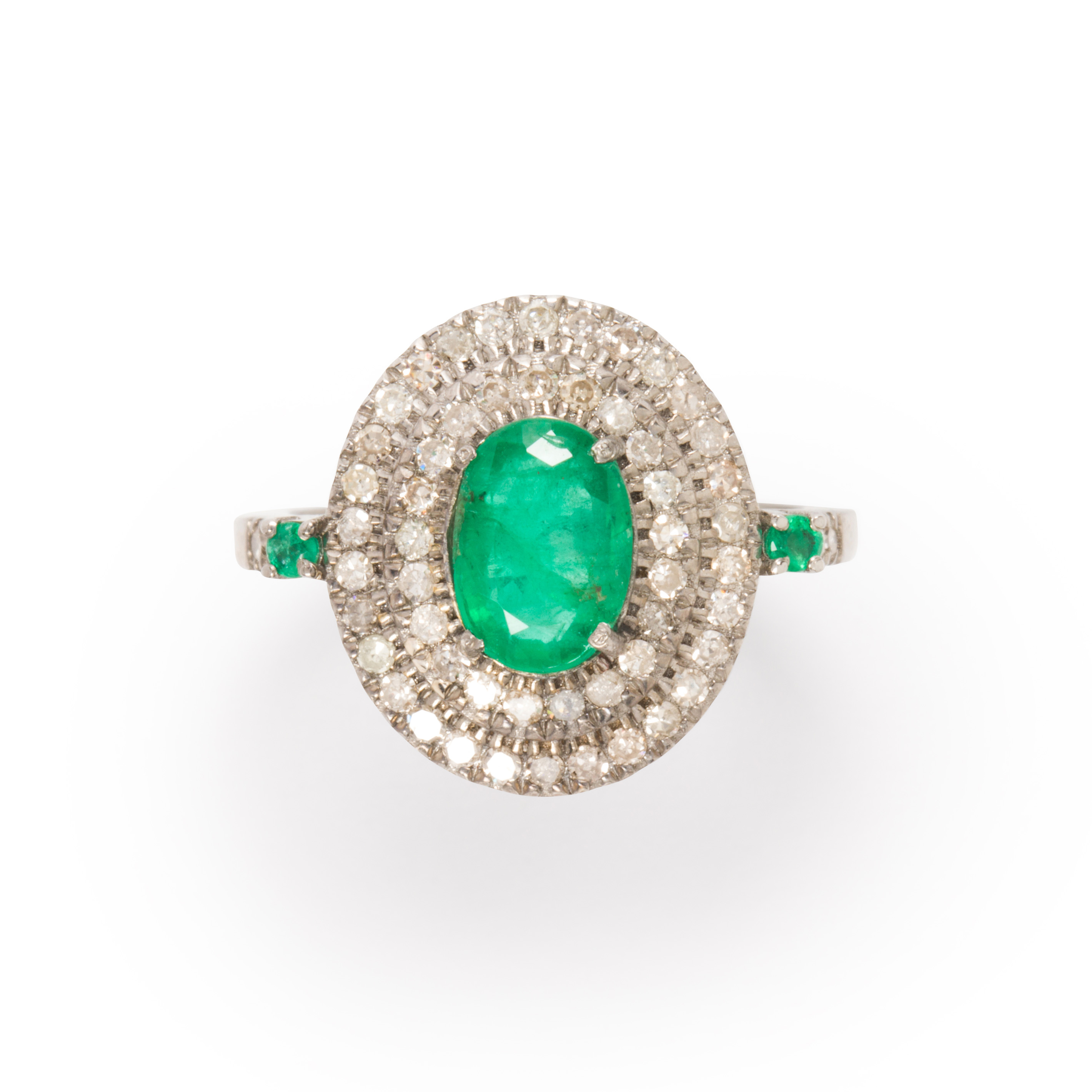 Appraisal: AN EMERALD AND DIAMOND RING An emerald and diamond ring