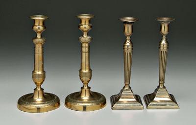 Appraisal: Two pairs brass candlesticks one pair with square bases tapered