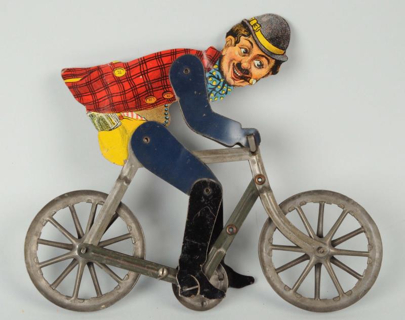 Appraisal: Charlie Chaplin Balancing Bicycle Tin Litho Toy Missing the weighted