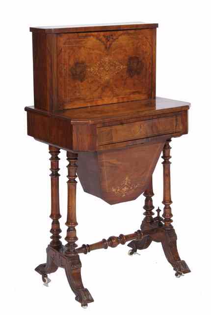 Appraisal: A VICTORIAN FIGURED WALNUT WORK TABLE the raised superstructure forming