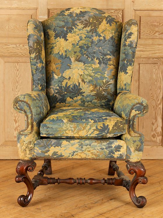 Appraisal: CARVED MAHOGANY BAROQUE WING CHAIR CIRCA A carved mahogany Baroque