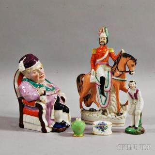 Appraisal: Five Ceramic Items a figural covered box of a seated