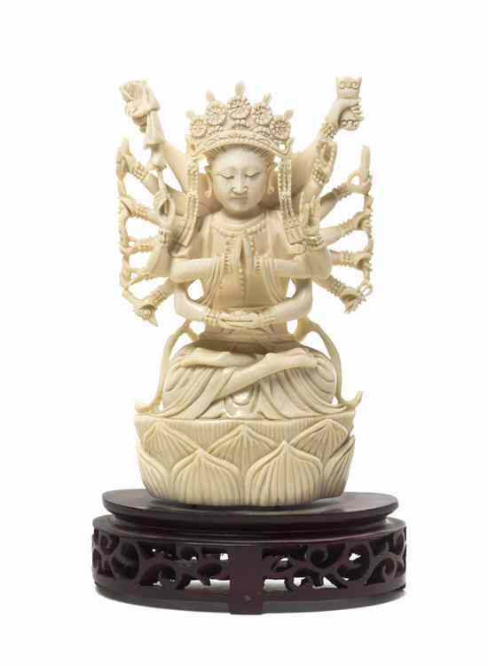 Appraisal: A Chinese Carved Figure of a Multi-Armed Deity depicted in