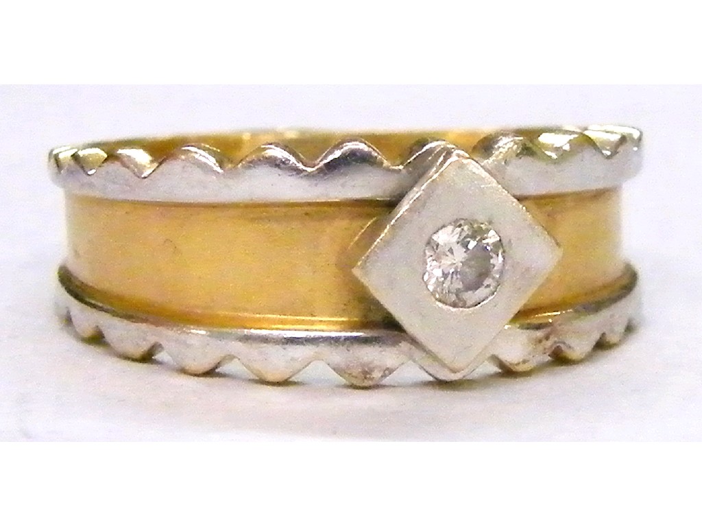 Appraisal: Two colour gold band ring set with a single diamond