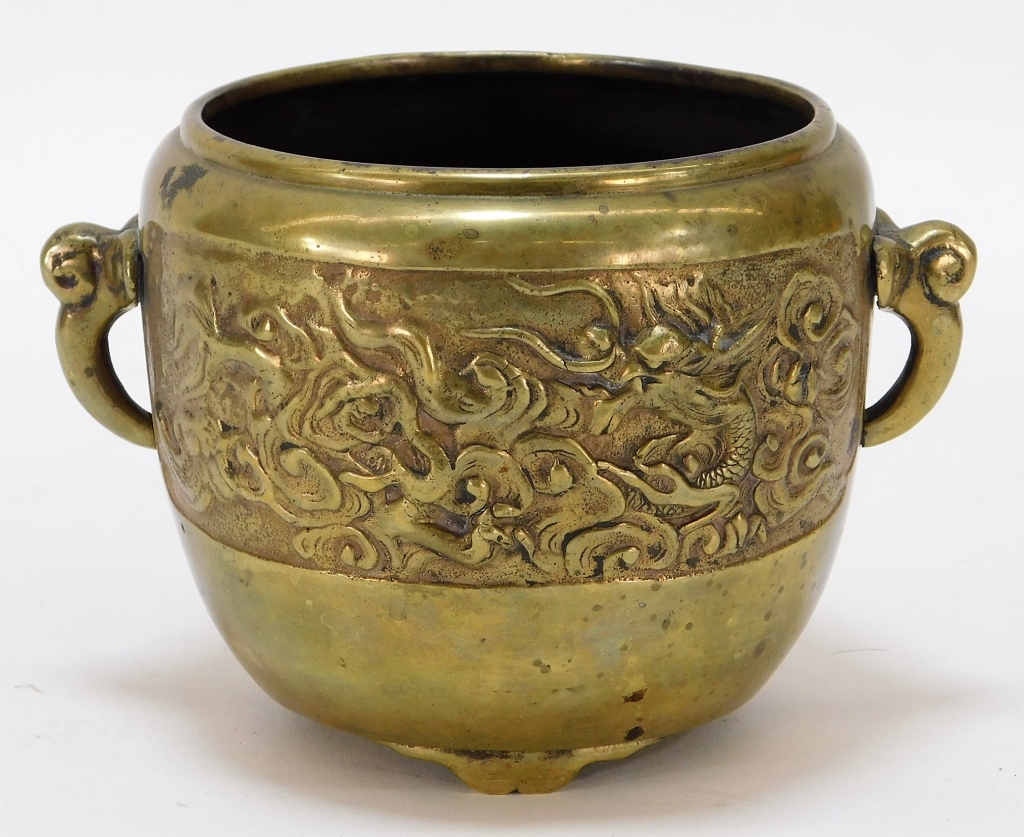 Appraisal: CHINESE CHASED GILT BRONZE TRIPOD DRAGON CENSER China Qing DynastySquat