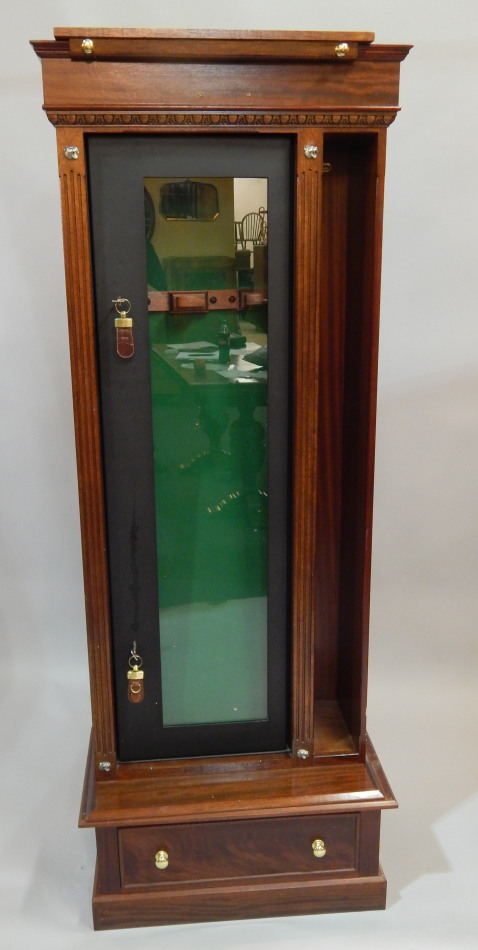 Appraisal: A gun cabinet with mahogany case work enclosing a metal