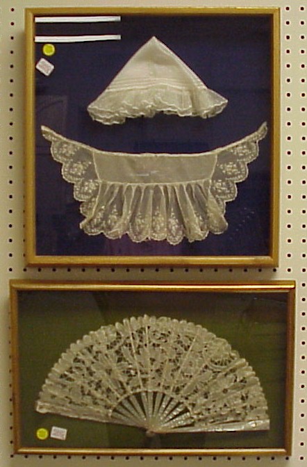 Appraisal: Two framed pieces lace fan with mother of pearl handles