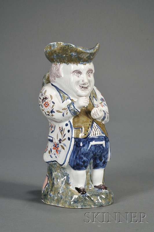 Appraisal: French Faience Snuff-taker Toby Jug France c polychrome enamel decorated