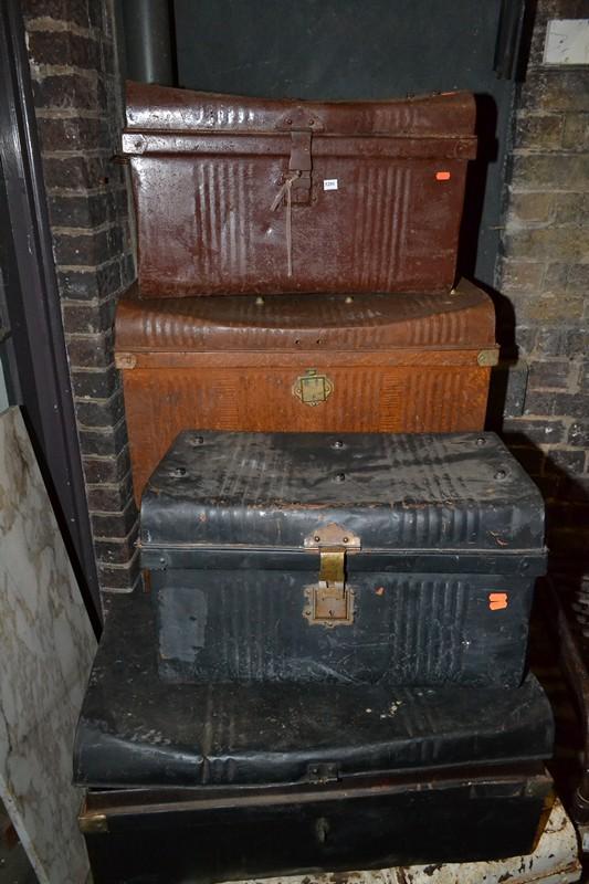 Appraisal: A GROUP OF SEVEN RUSTIC PAINTED TIN TRUNKS A GROUP