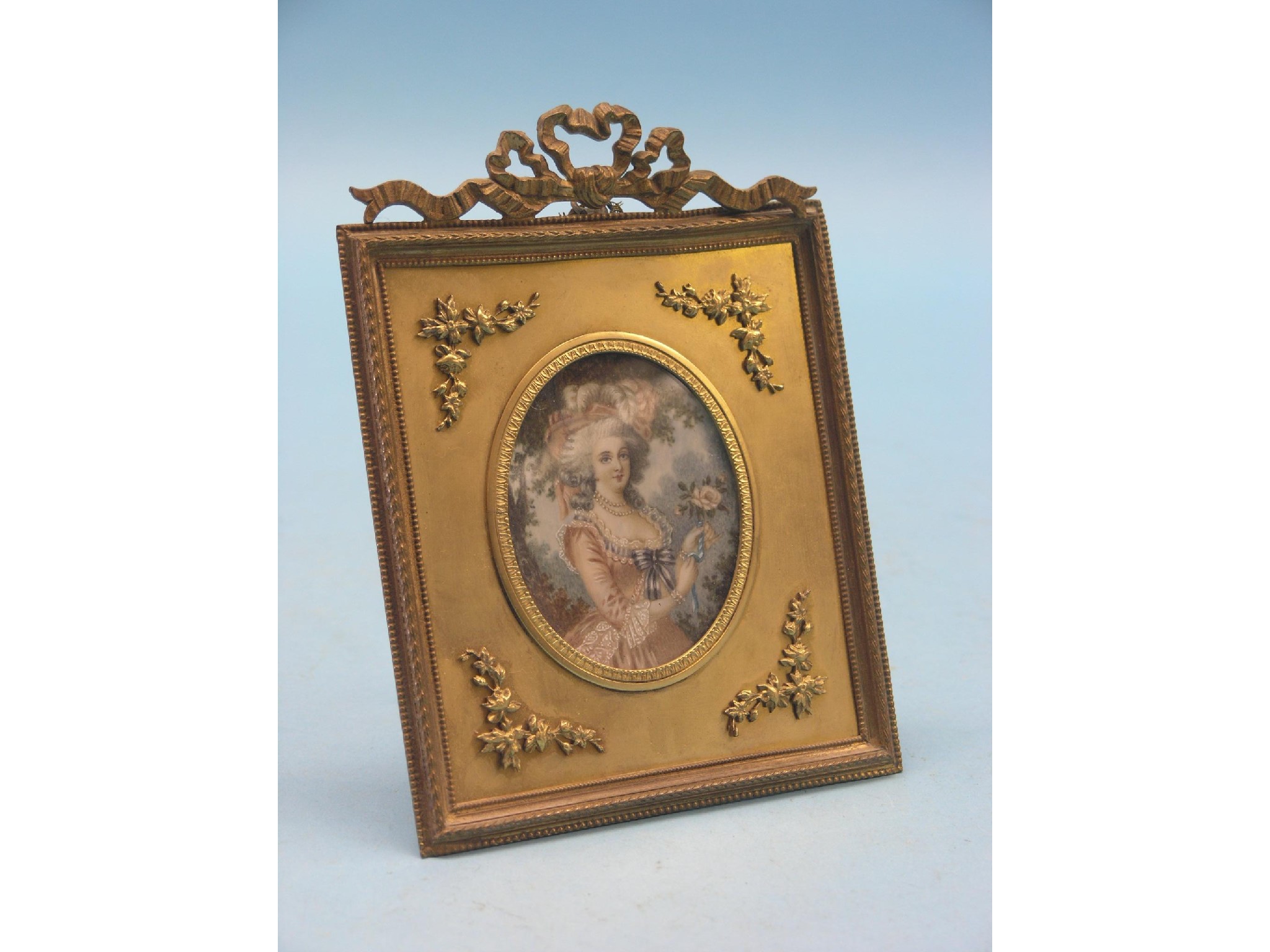 Appraisal: A miniature on ivory oval lady wearing pink dress and