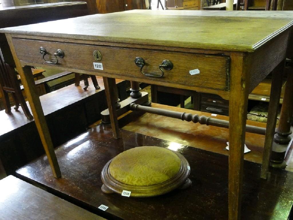 Appraisal: A Georgian oak side table fitted with a shallow frieze