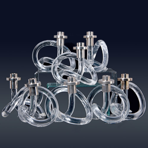 Appraisal: DOROTHY THORPE Set of eight lucite and chrome pretzel-shaped candlesticks