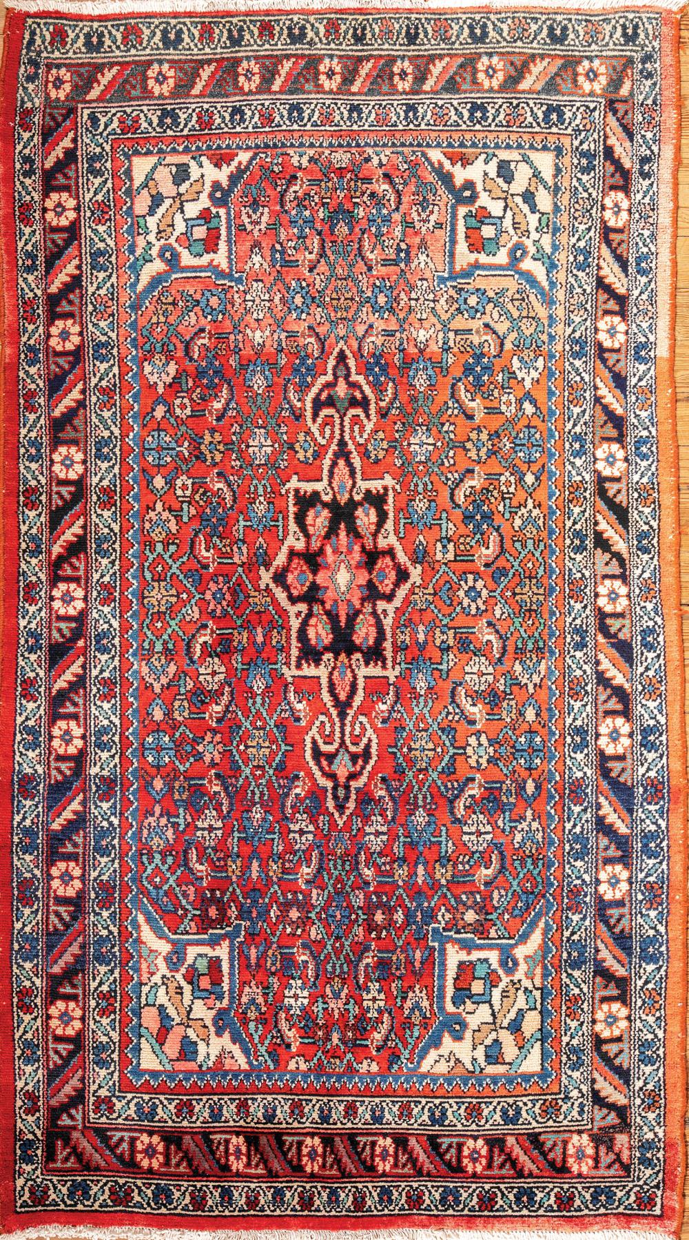 Appraisal: Persian Mahal Carpet red ground central floral medallion vine border