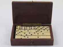 Appraisal: A box designed as a domino containing dominoes circa approx