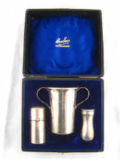 Appraisal: A silver shaving set comprising a shaving brush in reversible