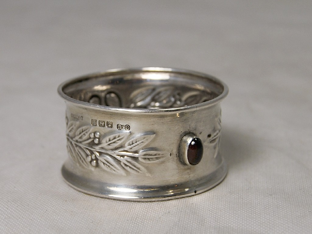 Appraisal: Art Nouveau silver napkin ring with cabouchon garnet insert and