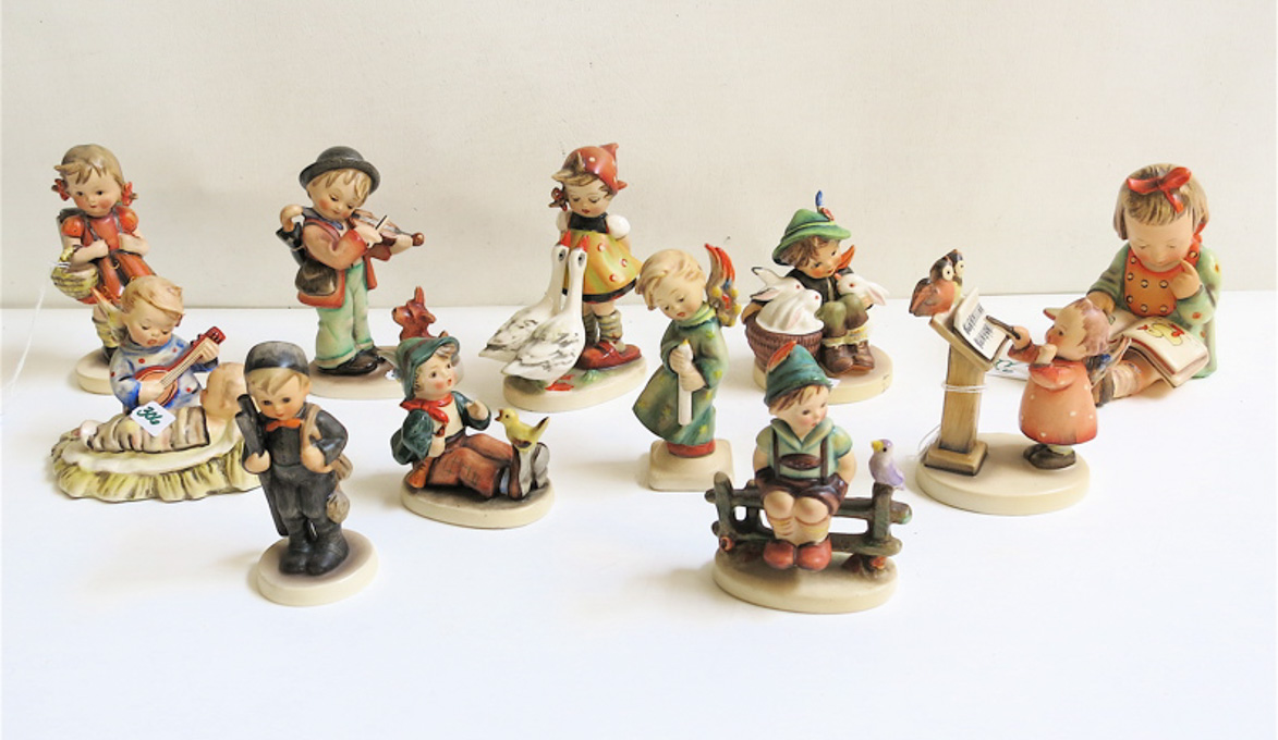 Appraisal: ELEVEN HUMMEL FIGURINES of soft paste porcelain TM- to TM-