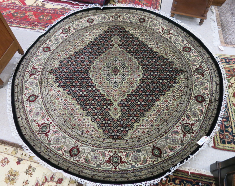 Appraisal: ROUND HAND KNOTTED ORIENTAL AREA RUG Persian Bidjar design overall