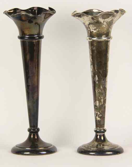 Appraisal: A large pair of silver spill vases Walker Hall Sheffield