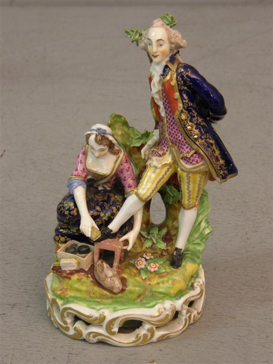 Appraisal: th century Derby figural group a lady polishing a gentleman's