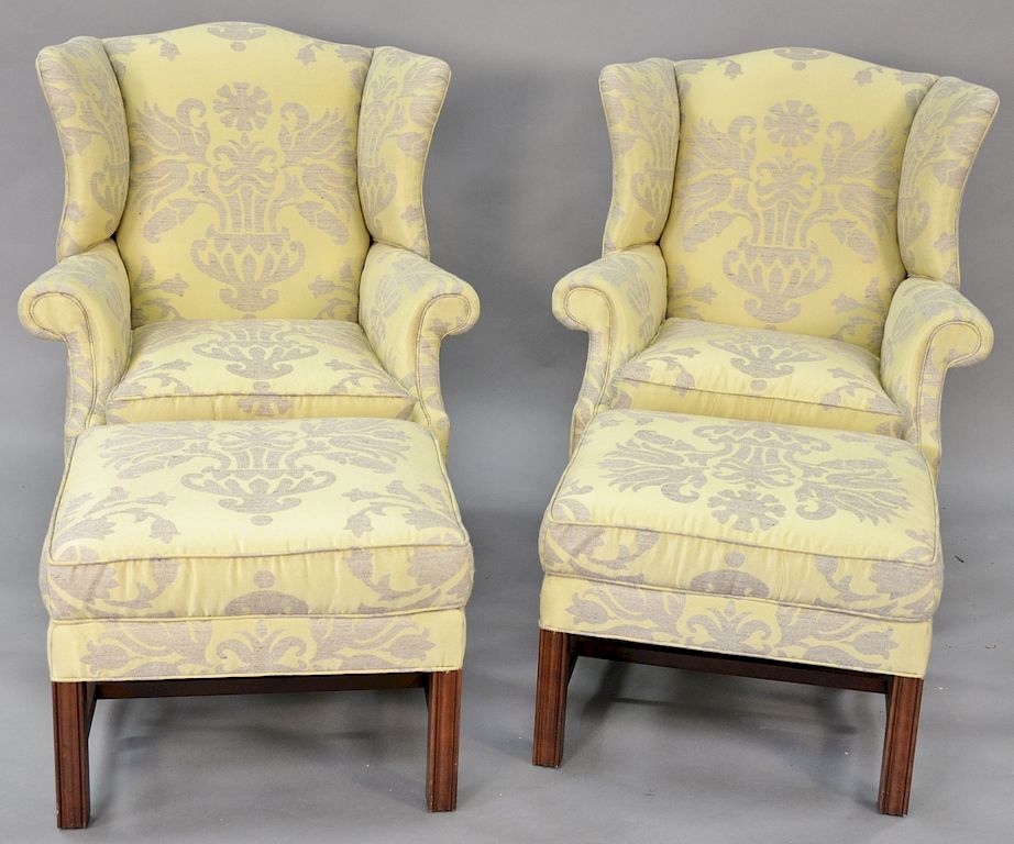 Appraisal: Pair Chippendale style wing chairs with matching ottomans in a