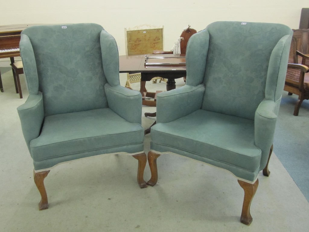 Appraisal: Pair of upholstered wing armchairs