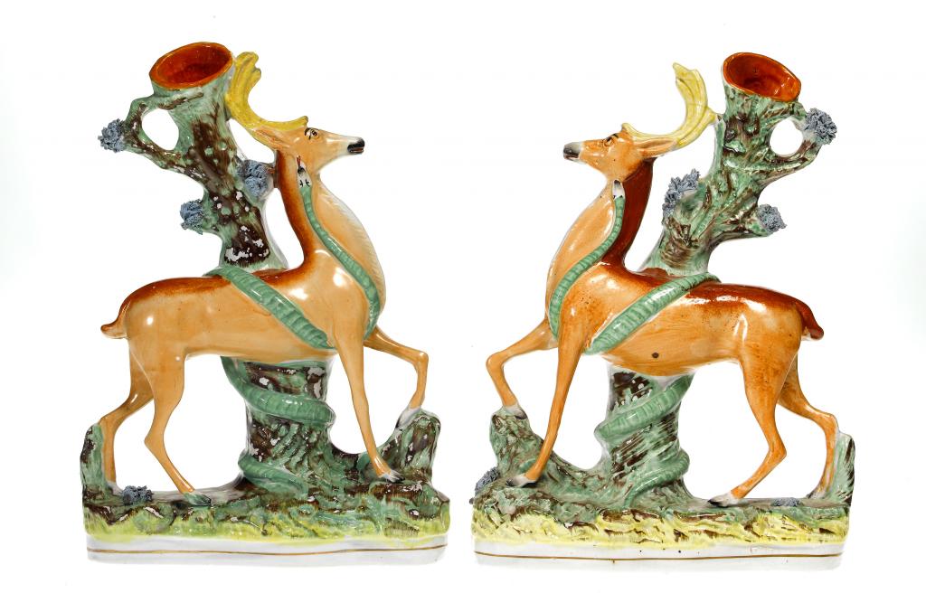 Appraisal: AN UNUSUAL PAIR OF STAFFORDSHIRE DEER AND SNAKE SPILL HOLDERS