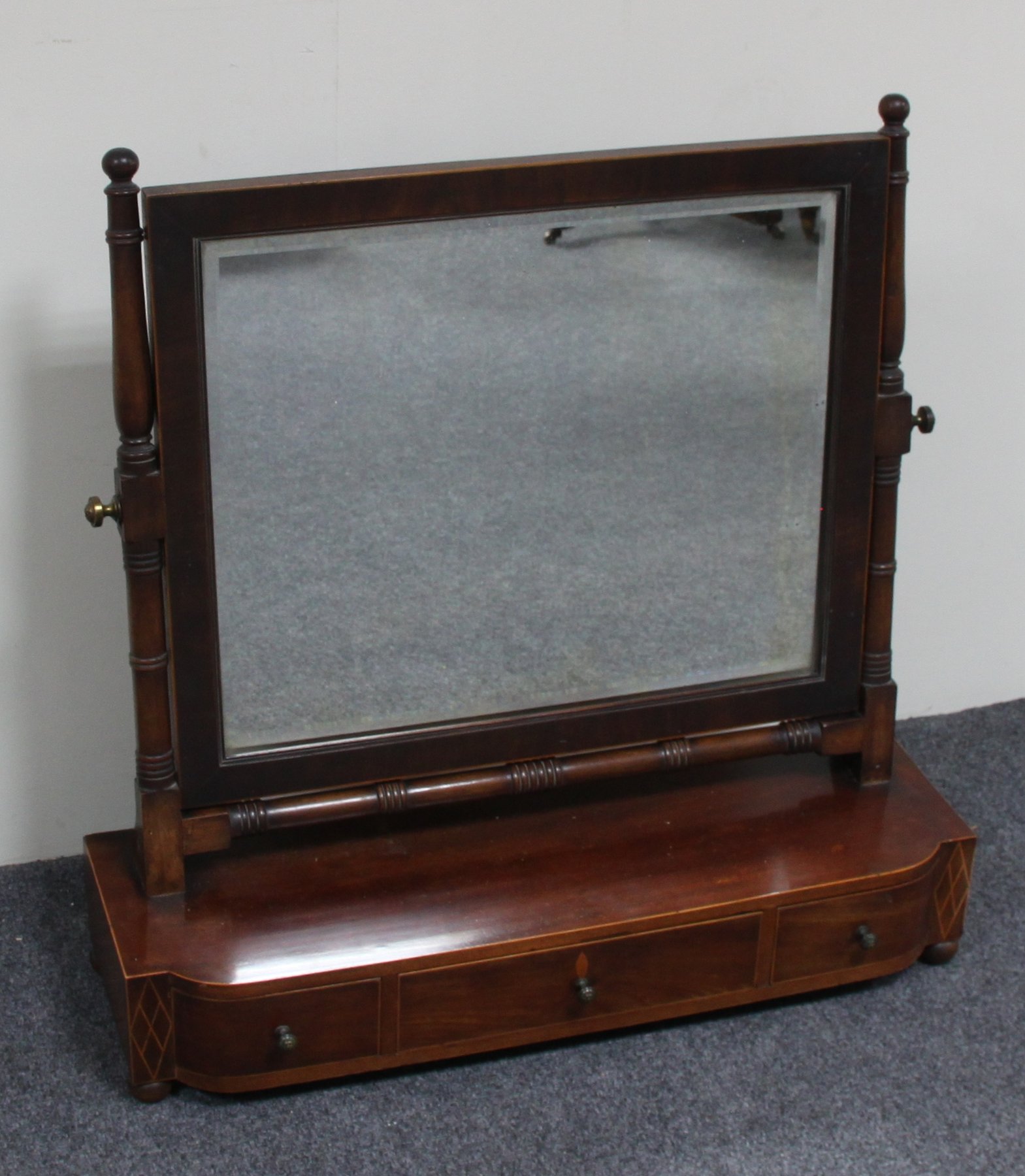 Appraisal: A th Century mahogany dressing mirror the rectangular bevelled glass