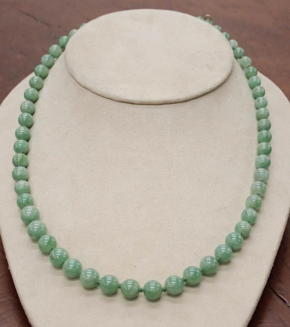 Appraisal: JADE AND FOURTEEN KARAT GOLD BEAD NECKLACE hand-knotted strand of