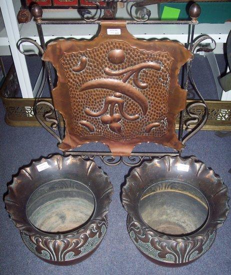 Appraisal: A pair of Art Nouveau embossed jardini re with flanged