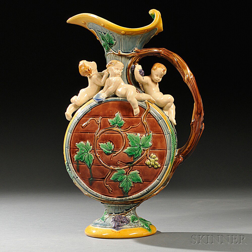 Appraisal: Minton Majolica Figural Hugues Prot t Design Ewer England barrel-form