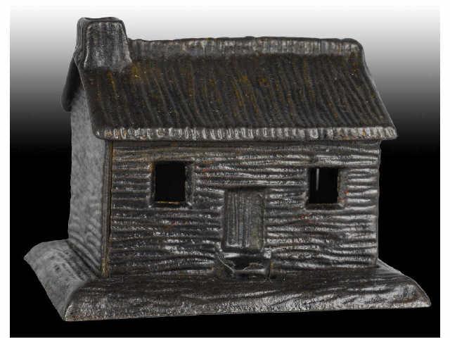 Appraisal: Cast Iron Log Cabin Still Bank Description Made in the