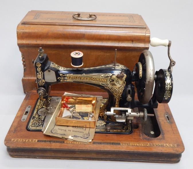 Appraisal: A Frister Rossmann sewing machine in inlaid walnut case