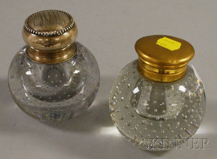 Appraisal: Two Colorless Trapped Bubble Pattern Paperweight-form Glass Inkwells one with