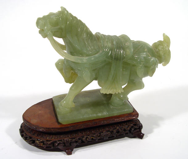 Appraisal: Large carved green jade horse on a hardwood stand the