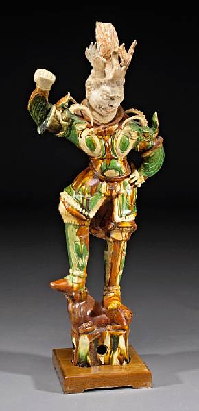 Appraisal: A large sancai glazed pottery guardian figure Tang Dynasty Displaying