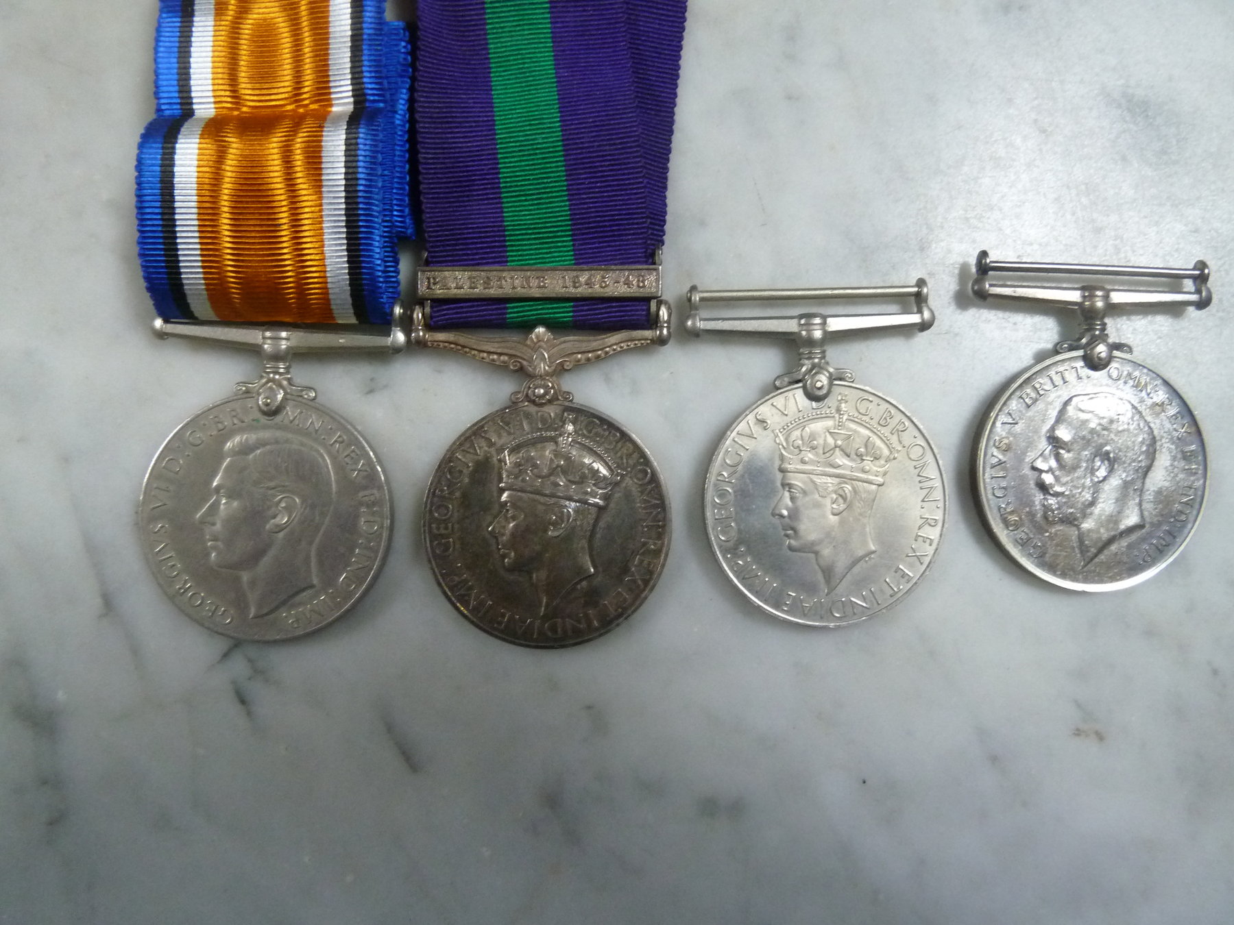 Appraisal: A George VI service medal a service medal with Palestine