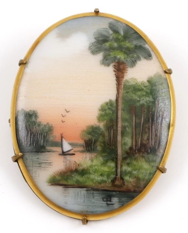 Appraisal: OLIVE COMMONS CAMEONA BROOCH PINFlorida scene painted on porcelain --