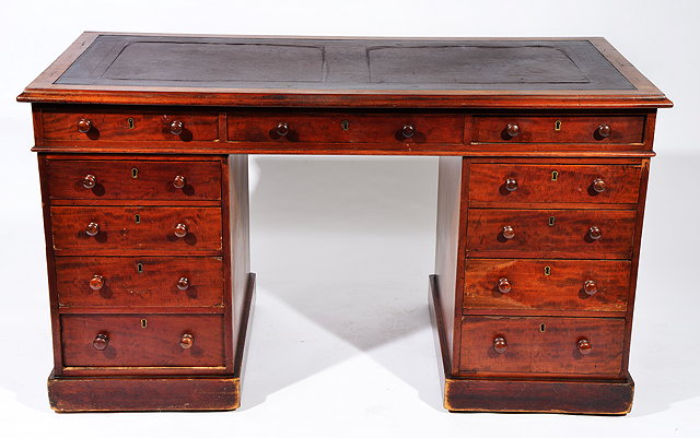 Appraisal: A VICTORIAN MAHOGANY PEDESTAL DESK with leatherette inset top and