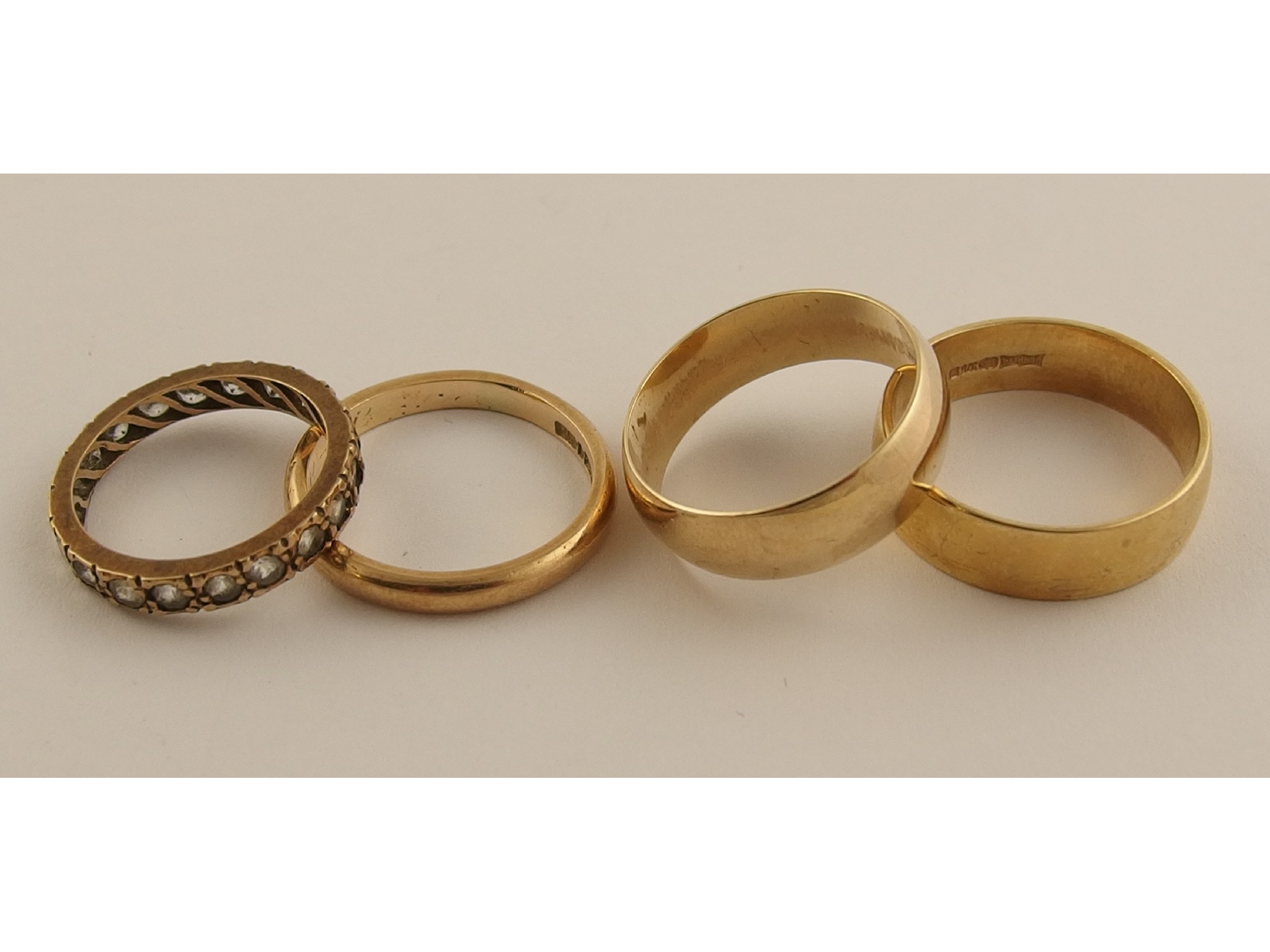 Appraisal: Three ct wedding bands and an eternity ring