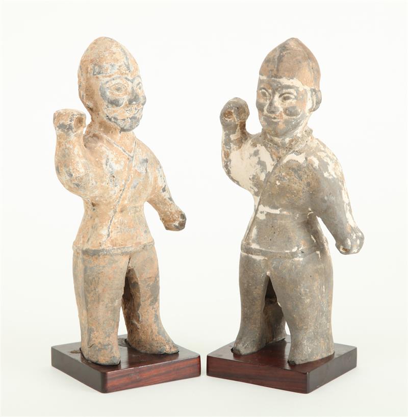 Appraisal: TWO SIMILAR WEI POTTERY FIGURES OF WARRIORS Each standing wearing