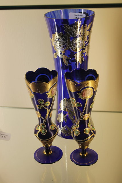 Appraisal: A BLUE AND GILT TAPERING VASE with flower designs cm