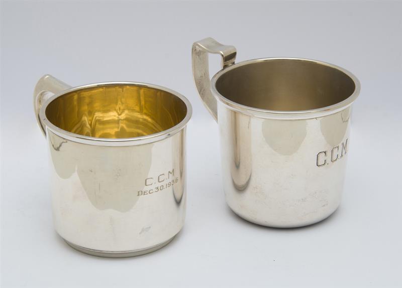 Appraisal: THREE AMERICAN SILVER BABY MUGS Comprising one Gorham with repouss