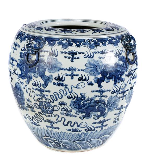 Appraisal: A Chinese blue and white fishbowl with mask handles th