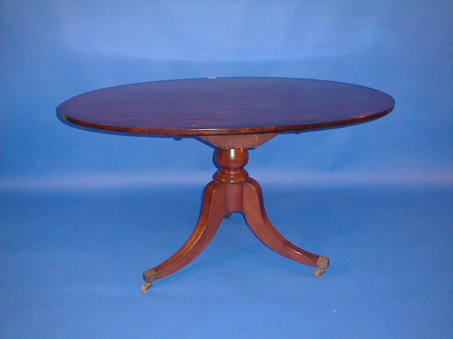 Appraisal: A thC mahogany snap top table with cross banded oval