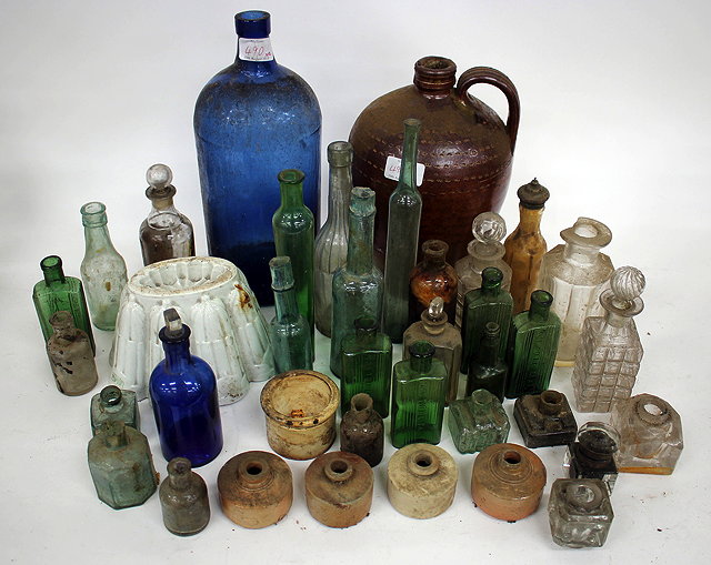 Appraisal: AN OLD BLUE GLASS BOTTLE a salt glazed bottle a