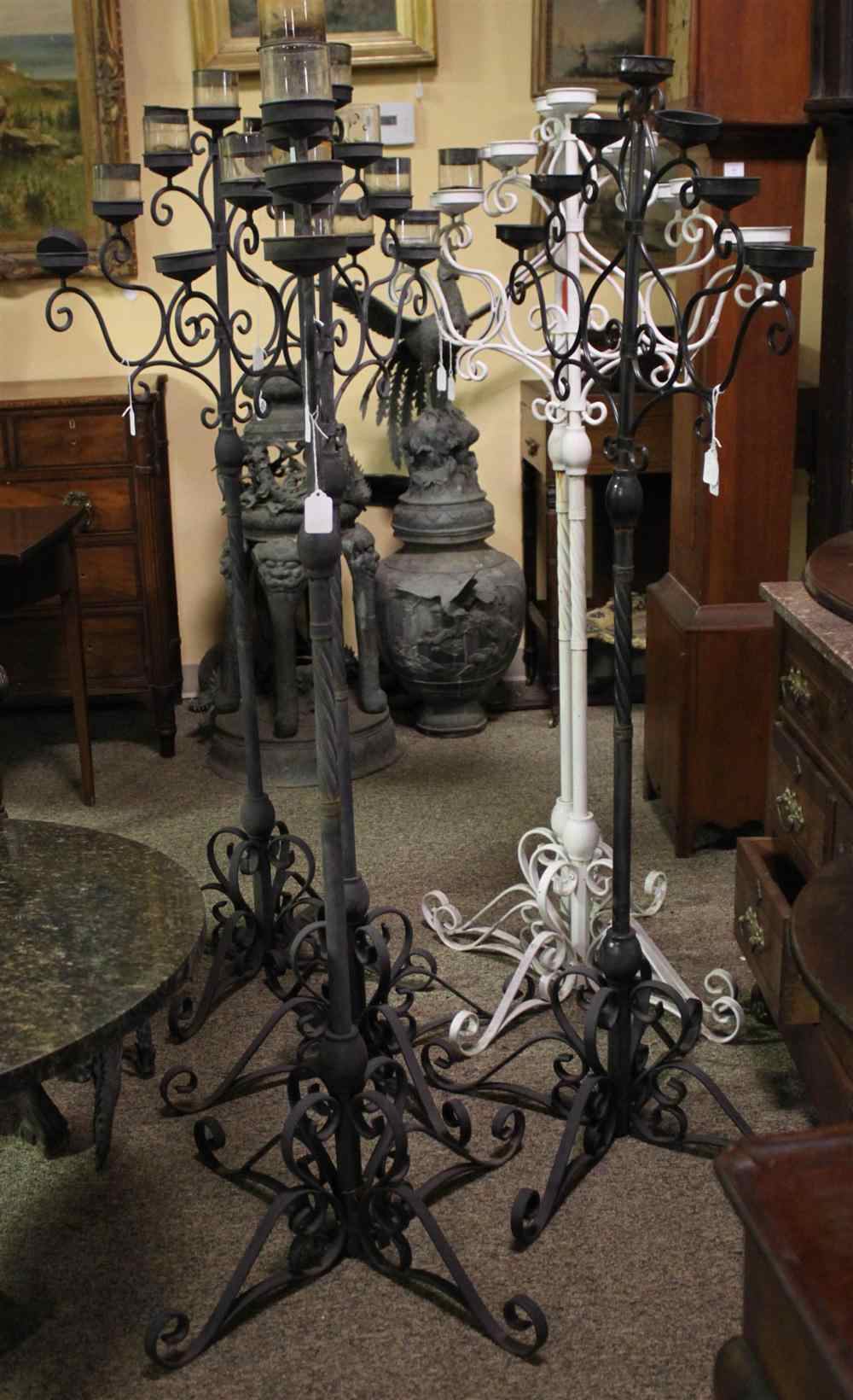 Appraisal: FOUR TALL BLACK FLOOR SEVEN-LIGHT CANDELABRA AND TWO TALL WHITE