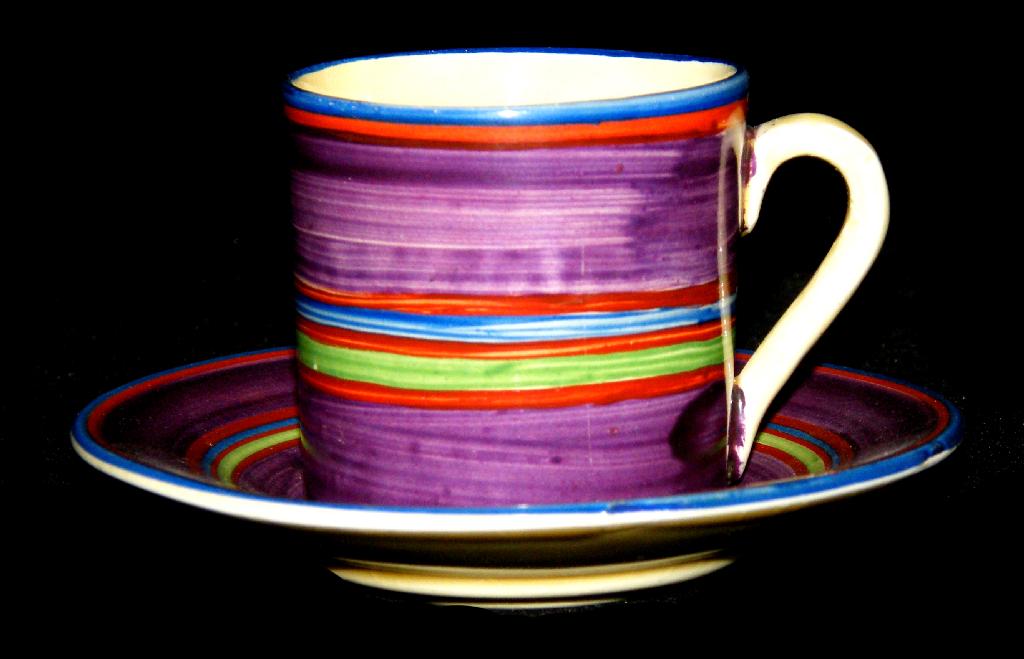 Appraisal: Original Bizarre' coffee can and saucer painted with bands in