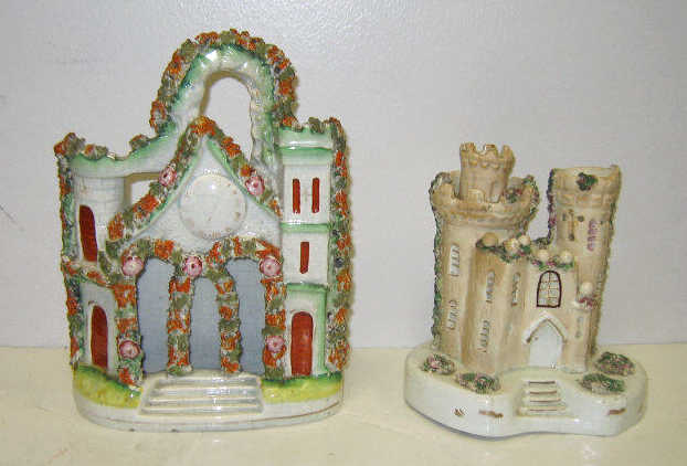 Appraisal: TWO STAFFORDSHRE CREAMWARE CASTLES One with arched entrance and molded