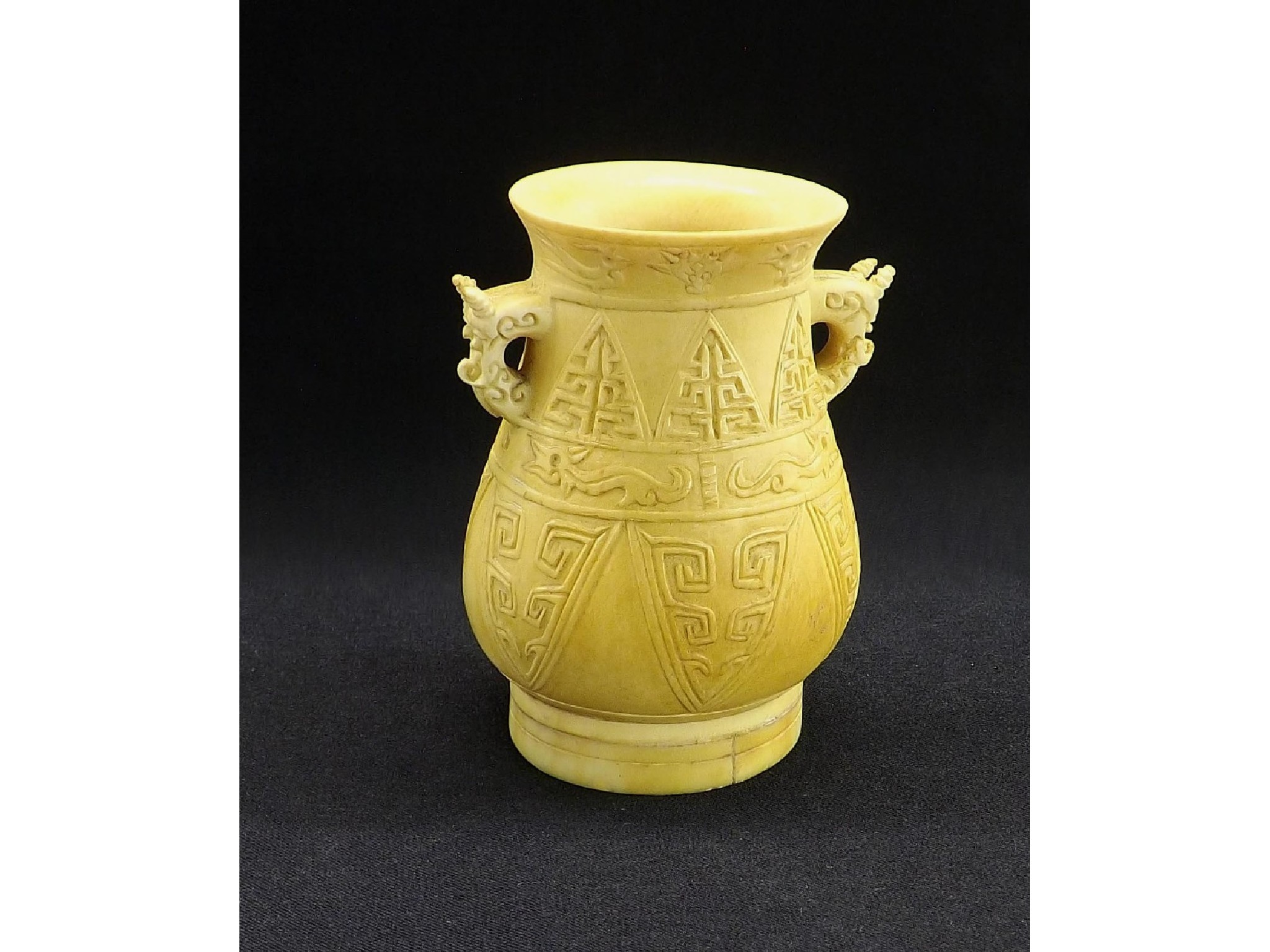 Appraisal: Ivory baluster temple vase carved to the sides with two